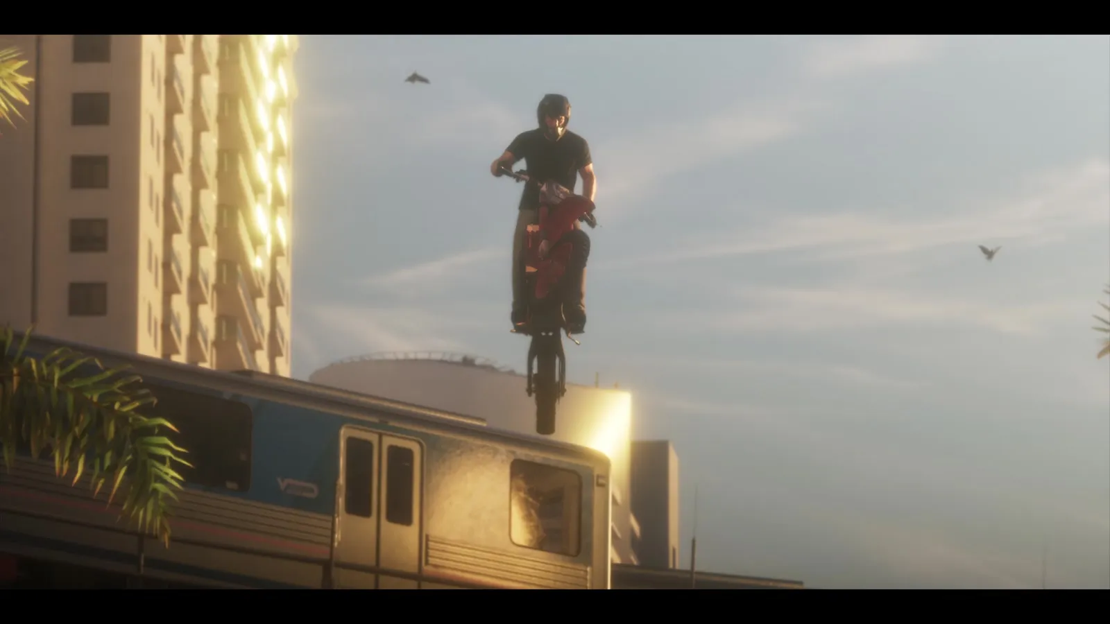 Мотоциклист в прыжке над надземным поездом · кадр третьего трейлера GTA 6 (15 октября 2026), 0:49 — GTA 6